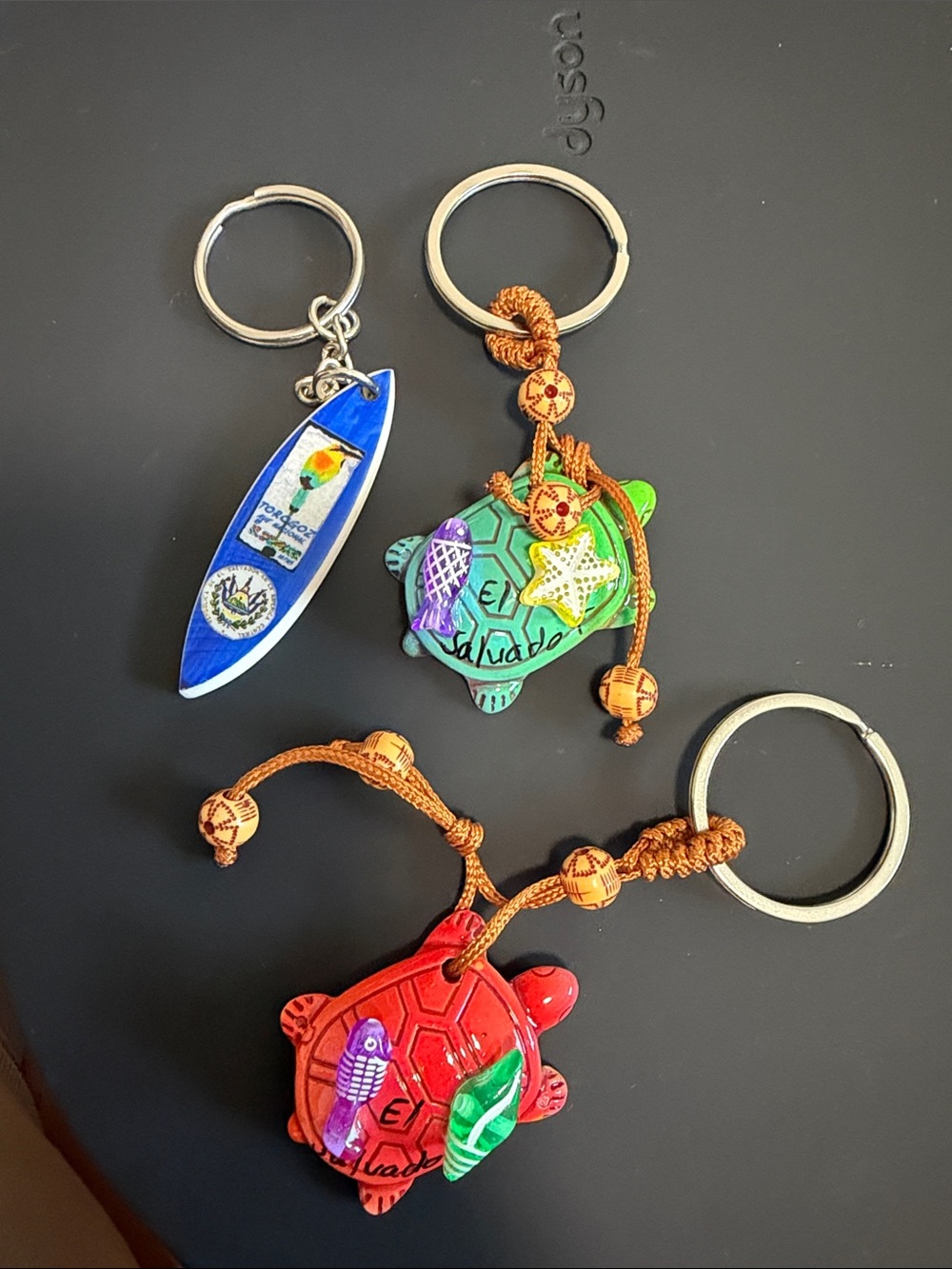 Handcrafted Turtle Keychain Set with Red and Green Turtles and Blue Surfboard -